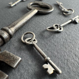 Collection of vintage keys on a dark surface