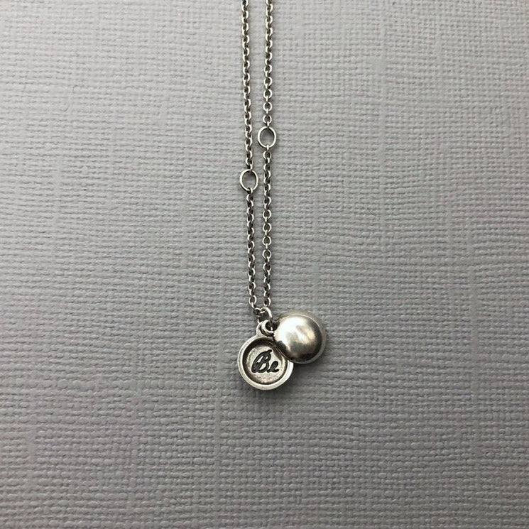 Meaning The tiniest locket, inscribed with the word 